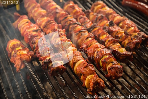 Image of Steak and other meat on barbeque. Background. Smoke. Meals, Clos