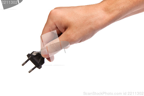 Image of Man is holding a black outlet in the hand