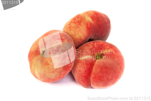 Image of Three ripe fig peach on white