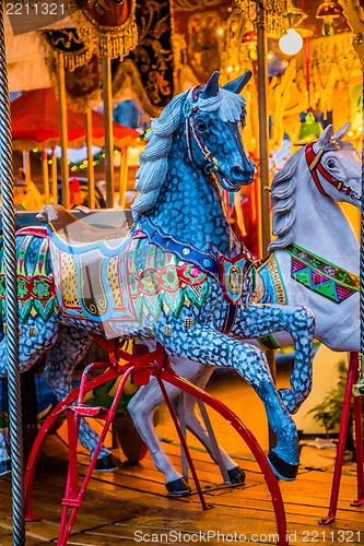 Image of Carousel. Horses on a carnival Merry Go Round.