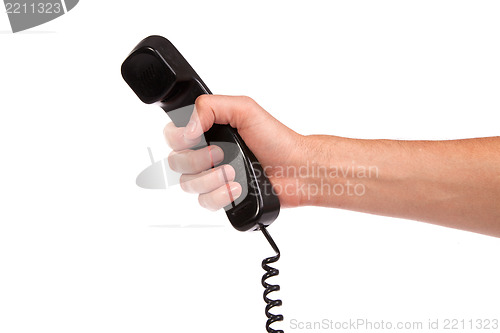 Image of Hand holding an old black telephone tube