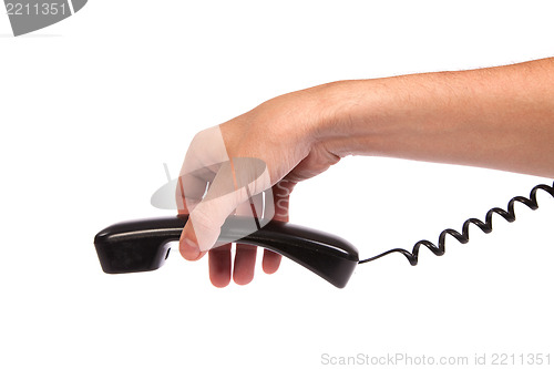 Image of Hand holding an old black telephone tube