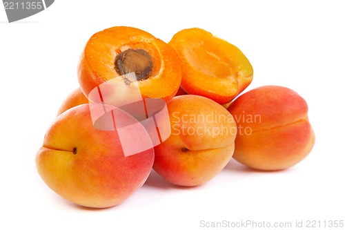 Image of Group of ripe apricots with a half