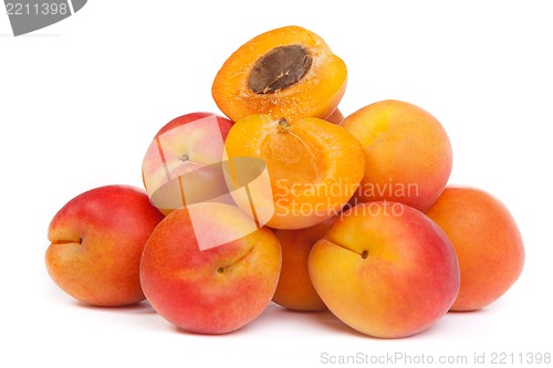 Image of Group of ripe apricots with a half