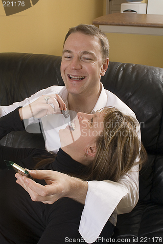 Image of couple on couch eating chocolate