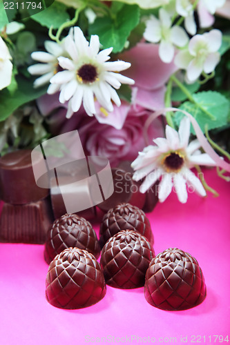 Image of Chocolate sweets and flowers