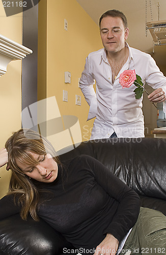 Image of man offering flowers to a woman