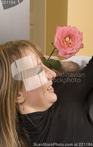 Image of man offering flower to a woman