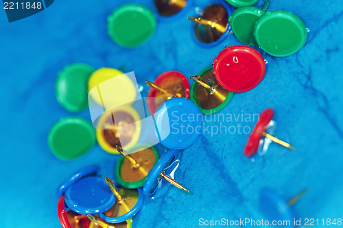 Image of Wet pushpins on a blur background