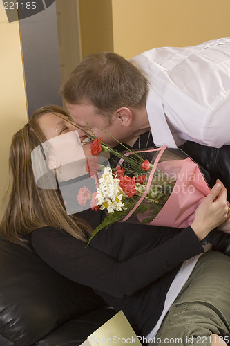 Image of man offering a bouquet to a woman