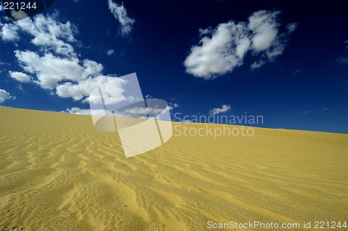 Image of Sand dune with clouds in the Wadi Rayan