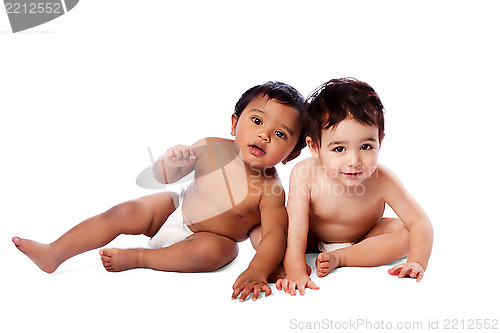 Image of Two cute babies sitting together