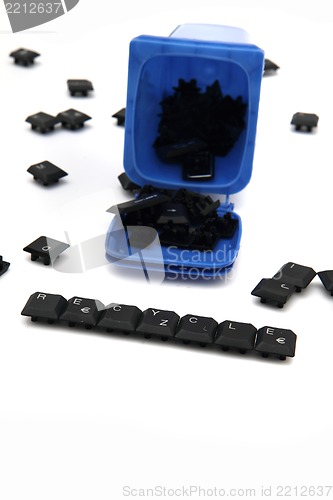 Image of keyboar keys in the blue kontainer