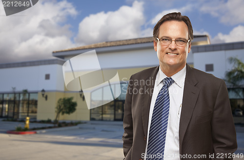 Image of Businessman In Front of Vacant Office Building.