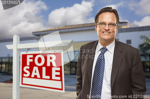 Image of Businessman In Front of Office Building and For Sale Sign