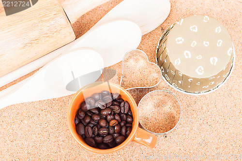 Image of Cup of coffee bean and bakery equipment on table