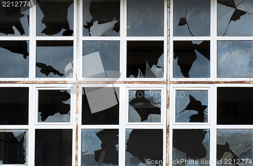 Image of Broken windows of old building