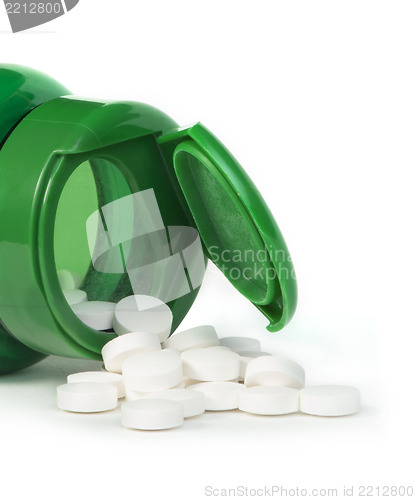 Image of White pills and a container