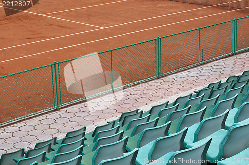 Image of Grandstand seats and tennis court