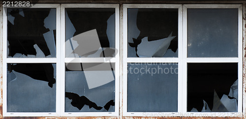 Image of Broken windows of old building