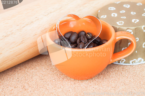 Image of Heart cookies cutter in cup of coffee bean  