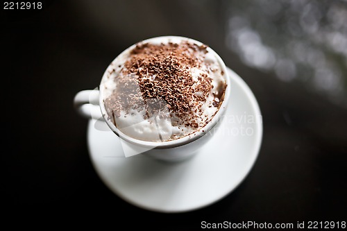 Image of Cappuccino in white cup with chocolate sprinkles