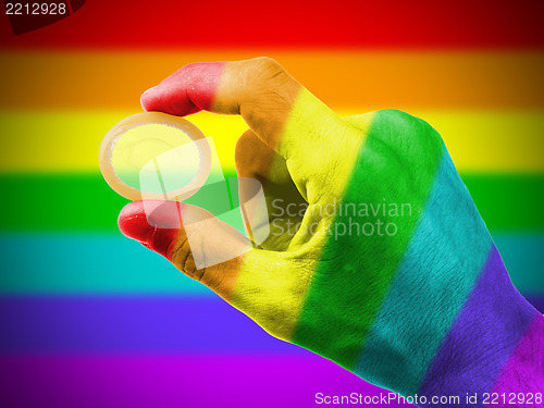 Image of Male giving a condom, rainbow flag pattern