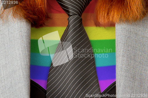 Image of Caucasian business woman with a tie, rainbow flag pattern
