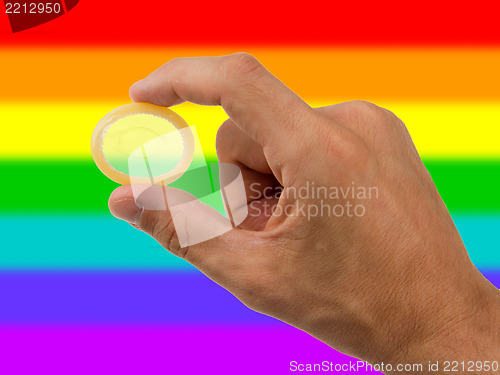 Image of Male giving a condom, rainbow flag pattern