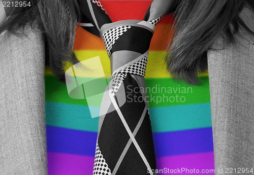 Image of Caucasian business woman with a tie, rainbow flag pattern