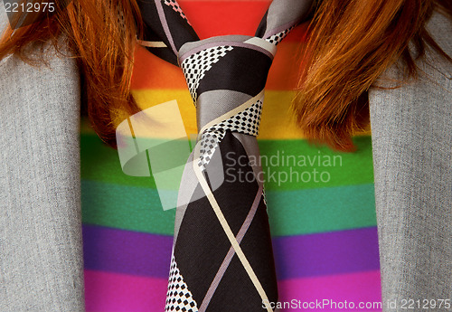 Image of Caucasian business woman with a tie, rainbow flag pattern