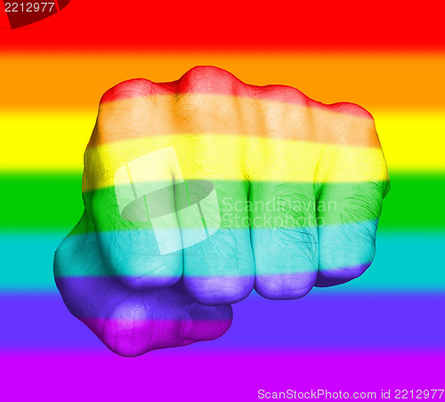 Image of Fist of a man punching, rainbow flag pattern