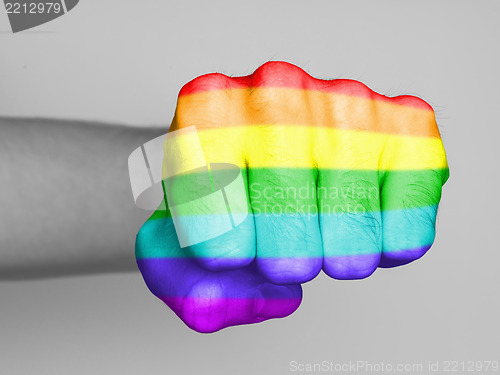 Image of Fist of a man punching, rainbow flag pattern