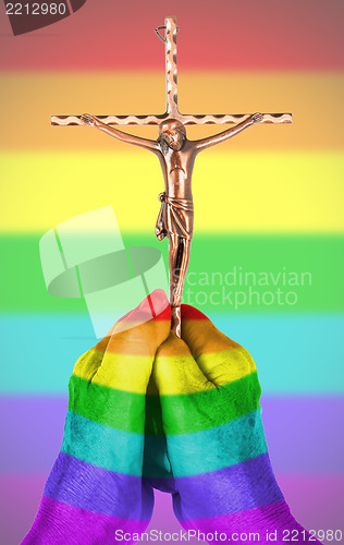 Image of Old woman with catholic crucifix, isolated, rainbow flag pattern