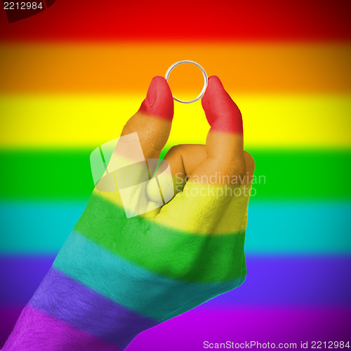 Image of Gay man holding ring