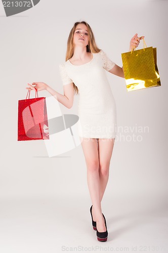 Image of Funny blond woman with shopping bags