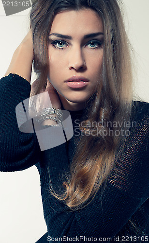 Image of young attractive woman blond hair in black dress looking at came