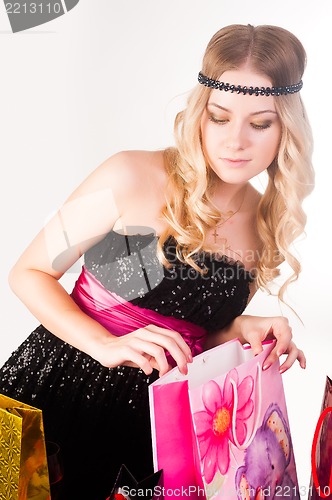 Image of blond woman with shopping bags