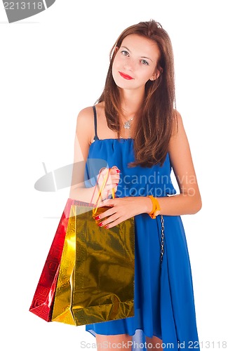 Image of Attractive woman holding bags