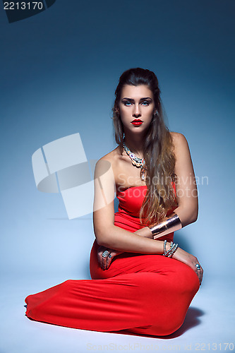 Image of Beautiful fashion young woman in red dress