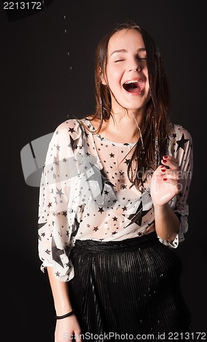 Image of beautiful woman in a wet clothes