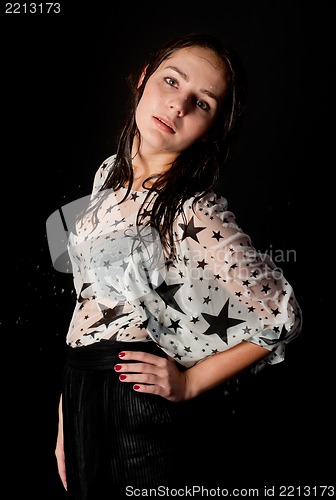 Image of young attractive woman in wet dress