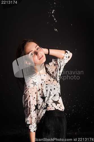 Image of young attractive woman in wet dress