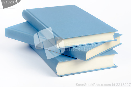 Image of Three blue books on a white background