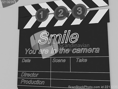 Image of Movie production clapper board notifying to the people that smil