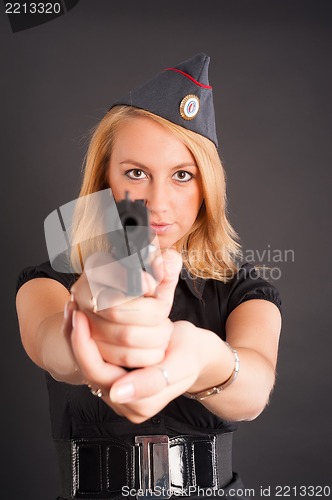 Image of Pretty woman with a gun