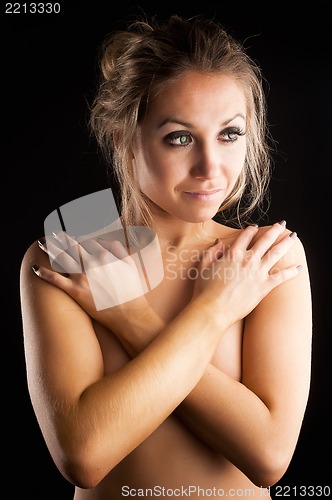 Image of Attractive woman covering breast