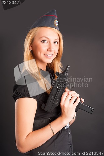 Image of Pretty woman with a gun