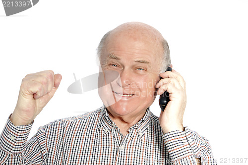 Image of Happy senior man on his mobile phone