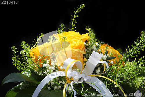 Image of A bouquet of flowers with a decorative ribbon